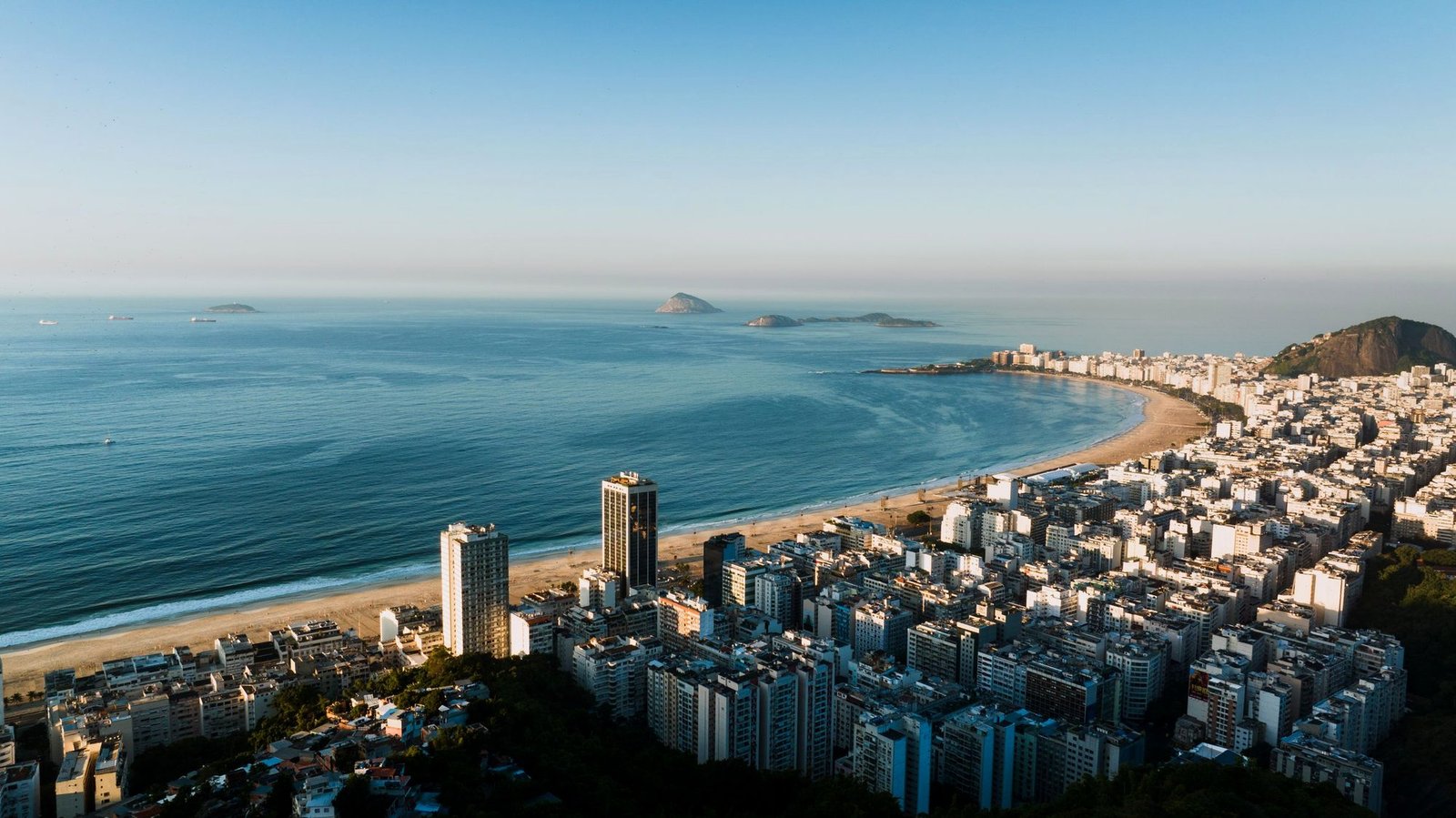 Aerial view of Copacabana beach and the Rio de Janeiro skyline at sunrise